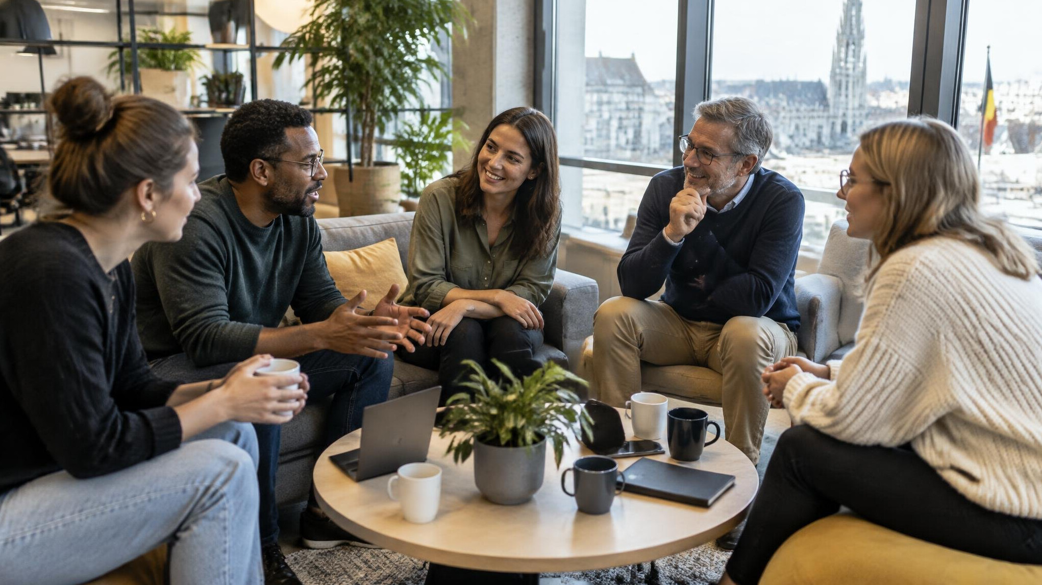 Colleagues having an informal discussion in a shared office space